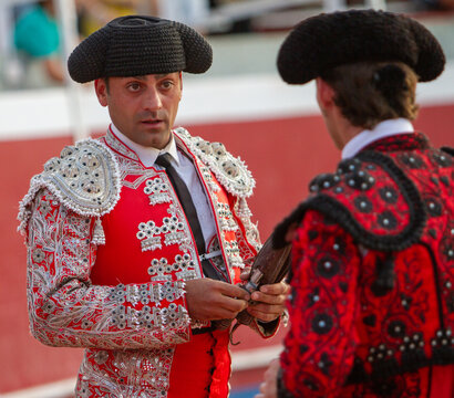 close up of a bullfighter speaking with his partner