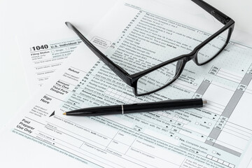 Pen on US individual tax form. Tax payment season