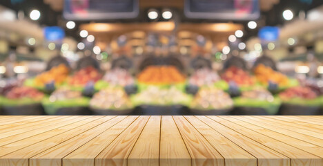 Empty wood table top with blur fruits in basket supermarket grocery store background - Powered by Adobe