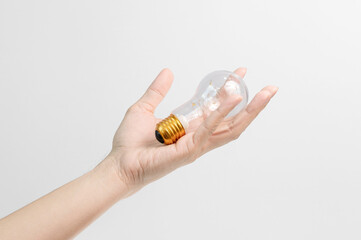 hand holding light bulb white background