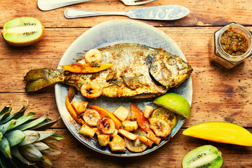 Baked grilled fish in fruit.