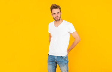 Fototapeta na wymiar handsome man in shirt on yellow background, mens beauty