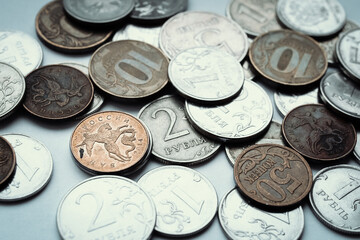 Metal coins rubles on a white background, top view, the texture of the coins