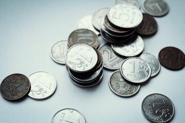 Metal coins rubles on a white background, top view, the texture of the coins