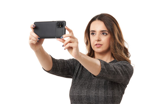 Businesswoman taking photos with smartphone