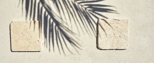Travertine stone display flat lay podium on travertine stone background and palm shadow. Product...