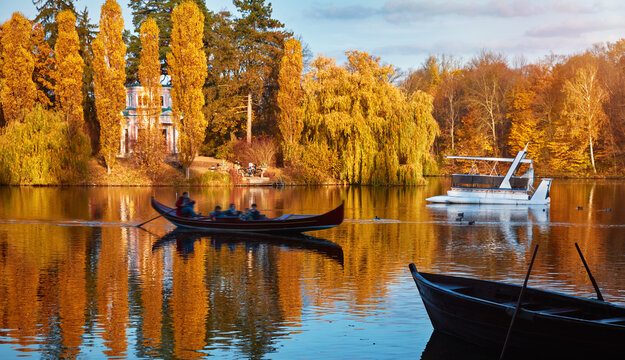 Landscape of Sofiyivka park in Uman, Ukraine with a flowerbed, lake, sunny autumn day.