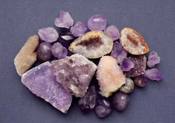 Amethyst purple natural stones in different varieties. Tumbled stones, amethyst druse and cactus...