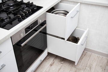 Modern sliding drawer system in the kitchen. Production of kitchen furniture. Ergonomics and...
