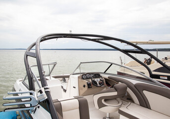 Fototapeta na wymiar Modern pleasure yacht on the lake for tourists, speedboat