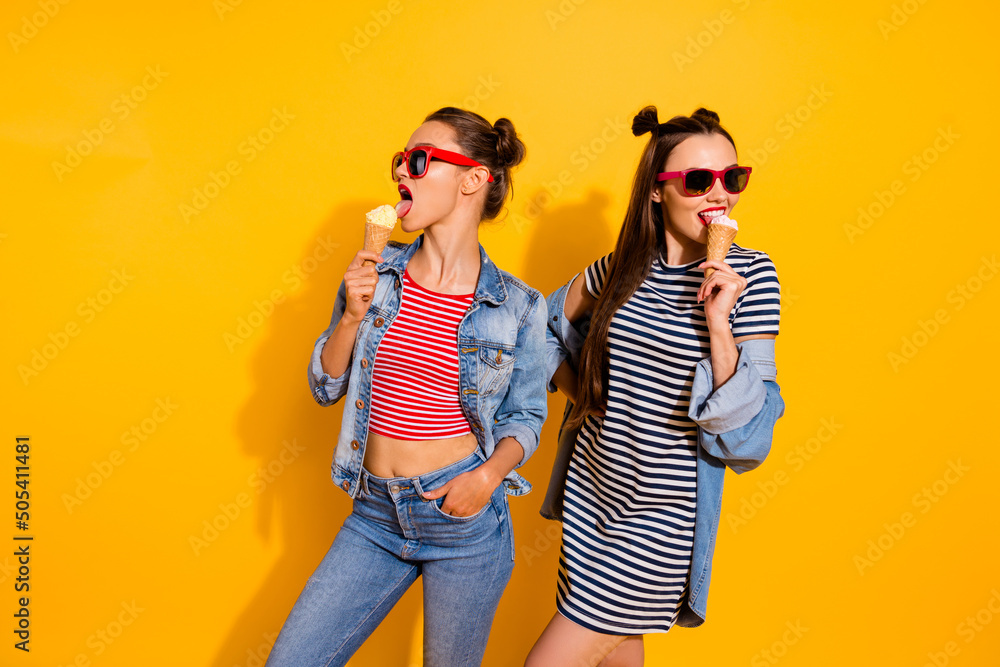 Sticker Photo of two pretty lovely people enjoy delicious ice cream free time walk isolated on yellow color background