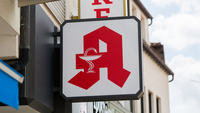 Stuttgart, Germany - July 27, 2021: Close up of a German pharmacy (german: Apotheke) sign / logo. Symbol for health and medicine.