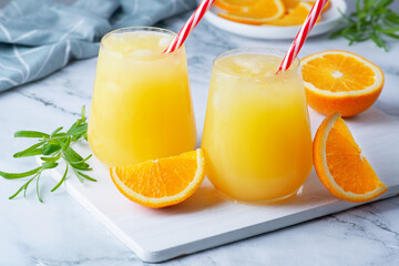 Glass of orange juice with ice. Cold orange fresh. Glass of orange juice for hot summer day