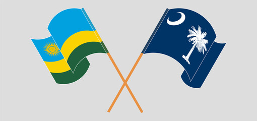 Crossed and waving flags of Rwanda and The State of South Carolina