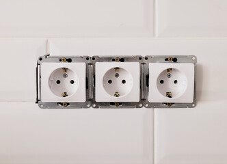 close-up, three sockets, repair. Installation of electrical equipment for the home