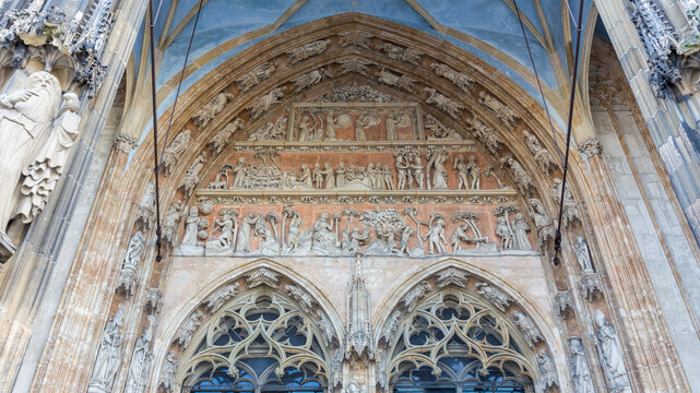 View on tympanon above the main gate of Ulm Cathedral (Ulmer M&uuml;nster). The historic sculptures resemble the creation of the world (genesis).