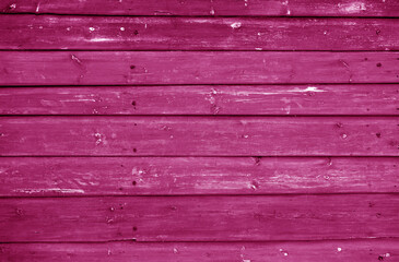 Wooden log house wall texture in pink tone.