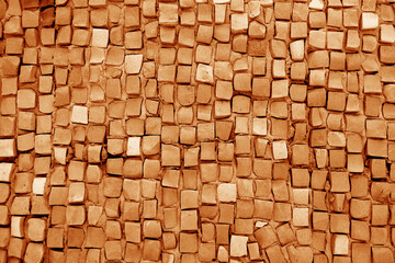 Color mosaic wall texture in orange color.