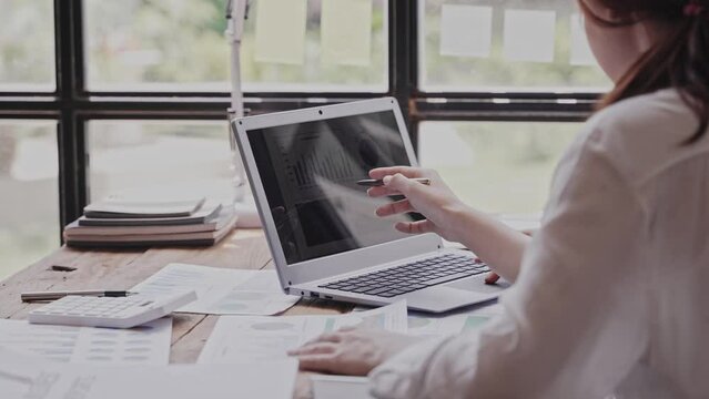 Teamwork with price chart analyzes business people on the table at the conference room.