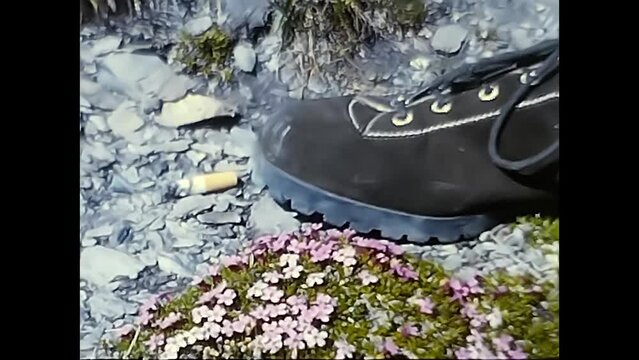 Mountain shoe with a cigarette butt from the 80s next to it