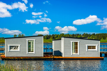 Floating fishing cabins on the lake water