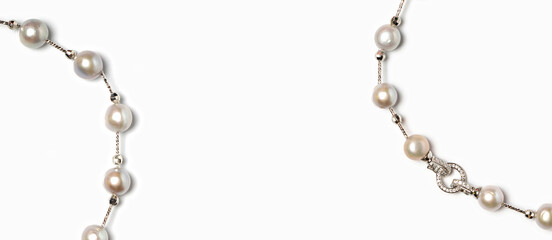 Freshwater pearl necklace with platinum hook and diamonds on white background. Collection of luxury...