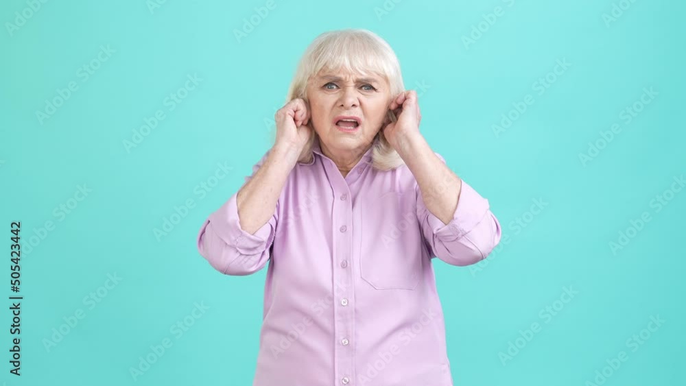 Canvas Prints Crazy aged lady hide ears loud music isolated aquamarine color background