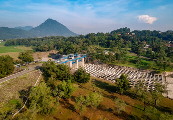 Aerial view of Jatiluhur reservoir with mountain on background. Architecture design water reservoir.