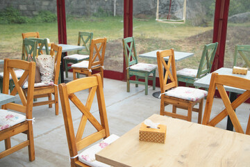 Tables and chairs at outdoor cafe restaurant.