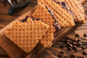 Coffee and dutch waffles. Espresso coffee and dutch waffles or syrupwaffles cookies with chocolate...