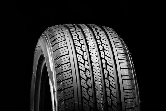 all-season new tire on a black background