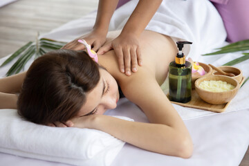 Obraz na płótnie Canvas Asian Woman Having Back Massage in Beauty Spa