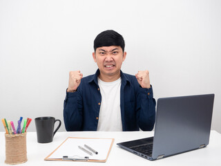 Businessman sitting at office workplace feel angry about working