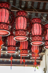 Traditional wooden red lantern chandelier in ancient Chinese building