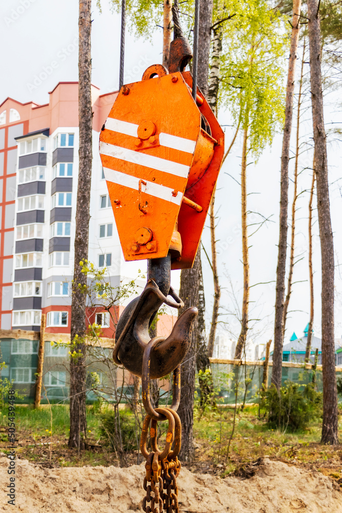 Poster crane hook for lifting loads. lifting device for stacking cargo. lifting and moving heavy loads on a