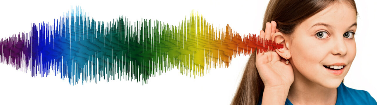 Smiling cute child with a hand near ear listening sounds and voices. Colorful sound waves showing hearing health, concept