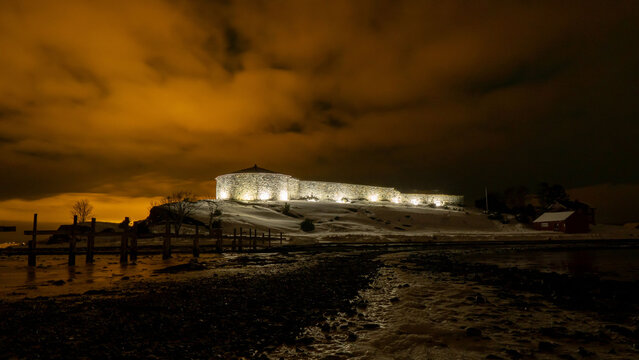 Beautiful shot of the illuminated Steinvikholm Castle at night in Norway
