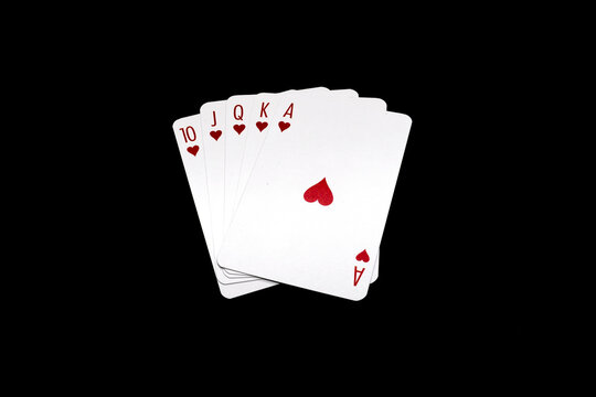 Royal Flush with hearts poker hand isolated on black background