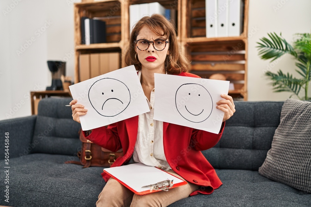 Sticker Young beautiful woman working on depression holding sad to happy emotion paper skeptic and nervous, frowning upset because of problem. negative person.