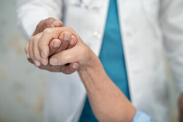 Holding hands Asian senior or elderly old lady woman patient with love, care, encourage and empathy...