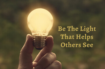 Motivational and Inspirational quote - Be the light that helps others see. With light bulb in...