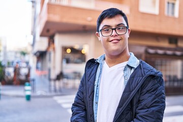 Down syndrome man smiling confident standing at street