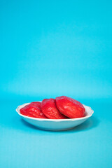 Traditional snacks that are often found in Indonesia, kue ku or kue tok, a fiery red cake filled with fine green beans