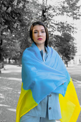 Portrait of woman with Ukrainian flag. Stand with Ukraine