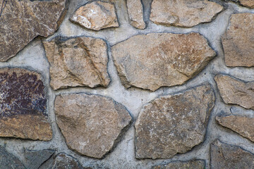 The area of the stone wall of marlstone with wide joints.