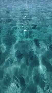 3D animation - Blue sea water surface with small waves in vertical composition
