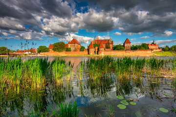 Naklejka na ściany i meble The Castle of the Teutonic Order in Malbork by the Nogat river. Poland