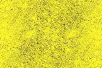 Distressed black grunge texture on a yellow surface