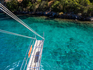 Boarding ramp of a tour boat anchored in on of the Göcek bays - Muğla, Turkey