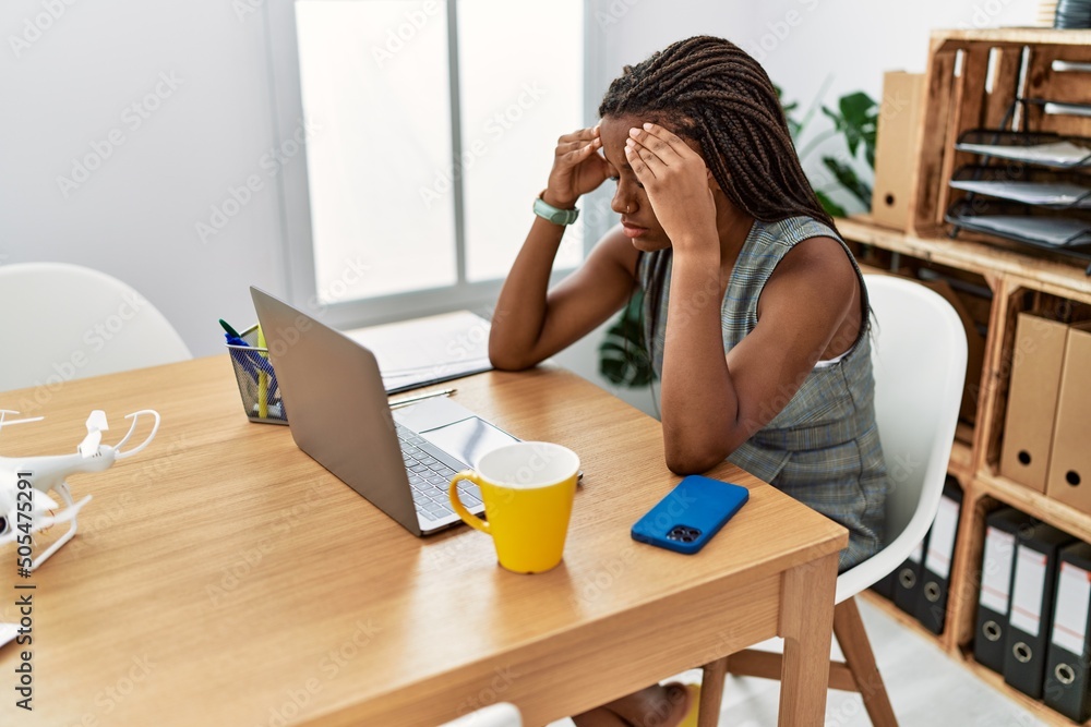 Wall mural Young african american woman business worker stressed working at office